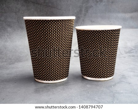 A couple of paper cups of coffee to take away.