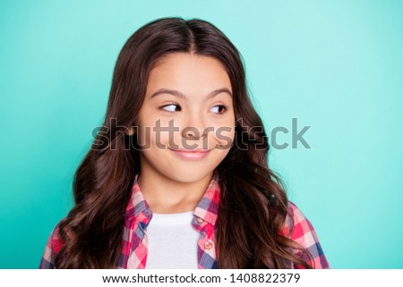 Close-up portrait of her she nice attractive lovely sweet tender dreamy confident cheerful wavy-haired pre-teen girl wearing checked shirt looking aside isolated on bright vivid shine blue background