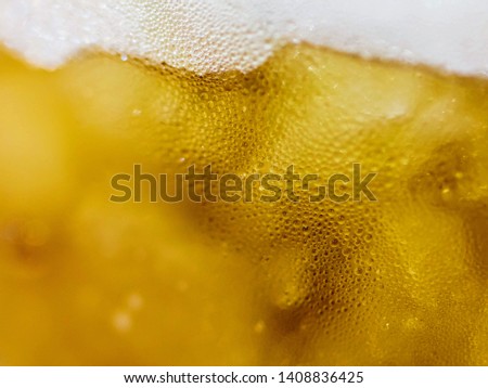 Macro pictures showing water drops and clear bubbles on the beer glass Beautiful amber