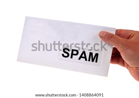 Spam concept with hand held envelope close up on white background