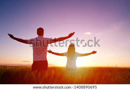 Couple feeling free in a beautiful natural setting. Royalty-Free Stock Photo #1408890695