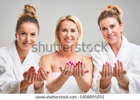 Picture showing group of happy friends in spa