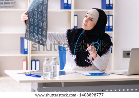 Young doctor in hijab working in the clinic 