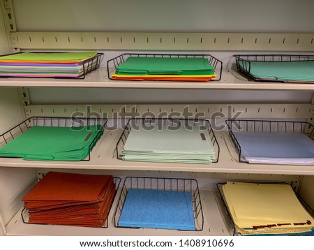 Shelves with office paper supplies.