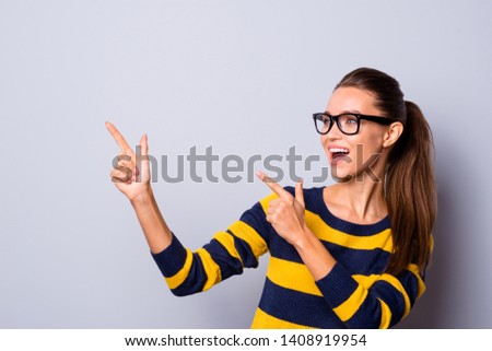 Portrait of funny funky cute lady university millennial advertise advise discounts novelties promo future promotion indicate choose decide tips wear striped colorful pullover isolated grey background