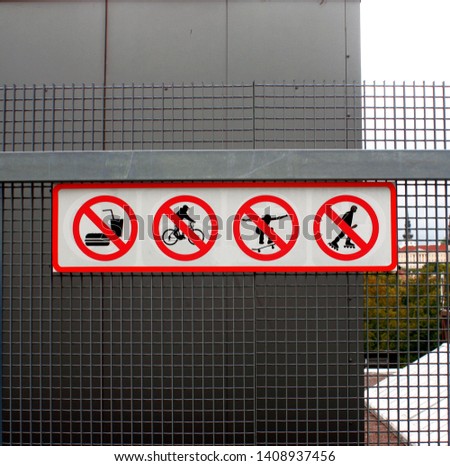 Restricting signs: no eating, no cycling, no skateboarding, no roller skating