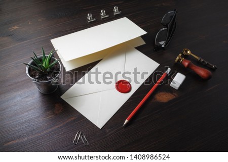 Vintage stationery and blank envelope on wooden background. Template for graphic designers portfolios.