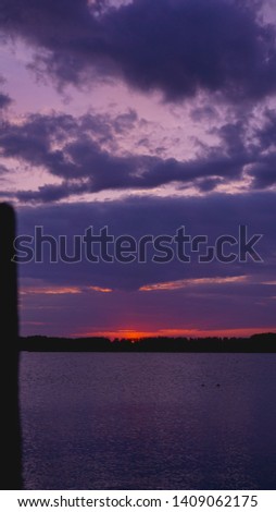 Violet purple sunset, Black sea surface under lilac sky