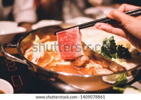 Ma La Hotpot, Spicy Chinese hot pot with beef, tofu, prawns, mushrooms, green leaves and noodles.