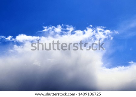 Beautiful white fluffy cloud formations on a blue sky taken in spring
