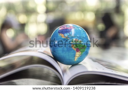 World globe on text book. Graduate study abroad programs. International education school Concept. 
