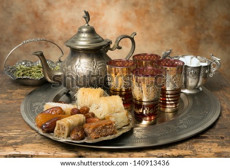 Oriental tea tray and cookies symbolising Moroccan hospitality Royalty-Free Stock Photo #140913436