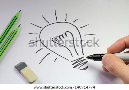 electric light bulb drawing on a white sheet of paper