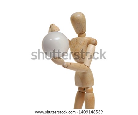 Wooden mannequins figure puppet Poses are holding round shiny objects  isolated on white background