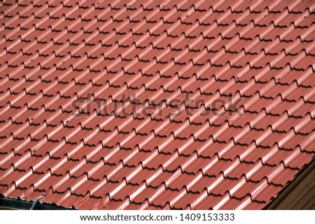 Abstract background texture, architectural details,brown ceramic roof tiles in seamless diagonal pattern on sunny day