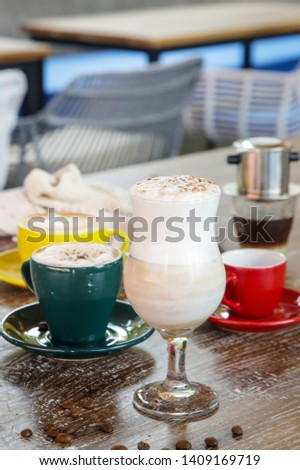 Different types of coffee on the wooden table

