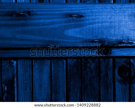 Dark blue painted boards of an old village house. Texture and Background