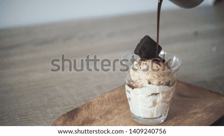 Ice cream with dripping coffee and brownies on top
