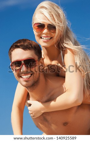 picture of happy couple having fun on the beach