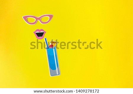 Photo booth props glasses and cocktail on yellow background. Stylish lady face created from summer props, glasses and lips. Summer concept. Top view. Flat lay. Copy space. 