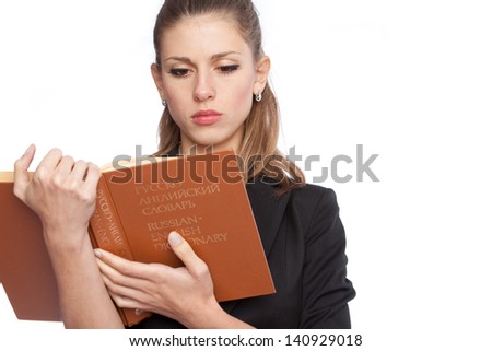 young girl with a Russian-English dictionary