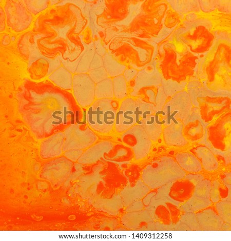 photography of abstract marbleized effect background. red and orange creative colors