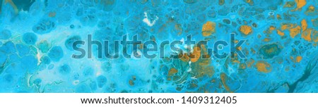 photography of abstract marbleized effect background. Blue, mint and white creative colors. Beautiful paint with the addition of gold. banner