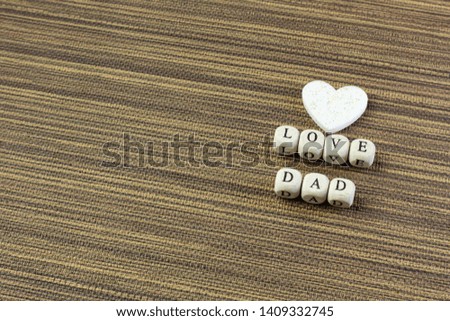 The wooden text  for father day content close up image.