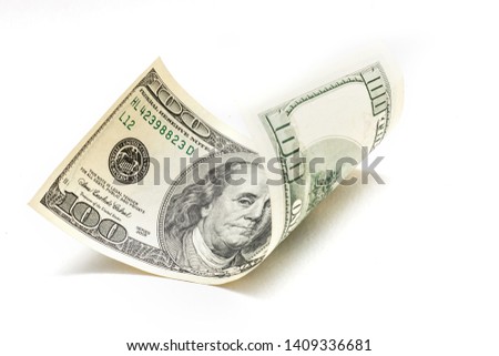 Single Hundred Dollar Bill Curled on White Royalty-Free Stock Photo #1409336681