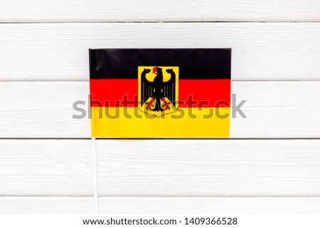 Flag of Germany on white wooden background top view