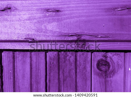Purple-violet painted boards of an old village house. Texture and Background