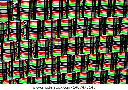 An interesting image of mugs stacked up to form a backdrop.