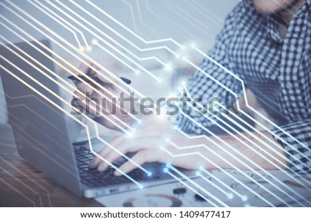 Businessman with computer background with technology theme hologram. Concept of hightech. Multi exposure.