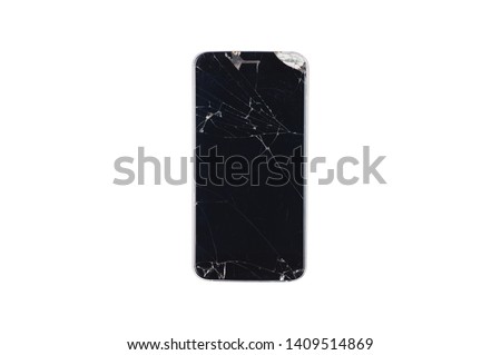 One damaged black smartphone with many scratches and crack on body isolated on white background. Top view