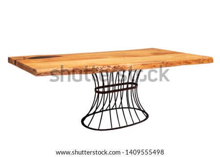Wood and epoxy table and metal legs in wooden interior