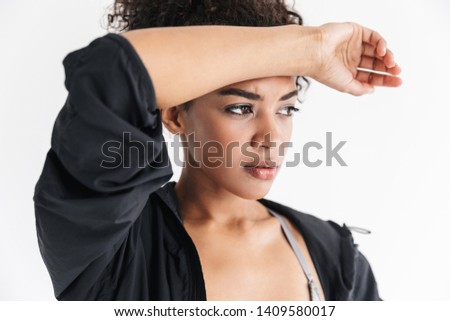 Image of a beautful tired young amazing sports fitness african woman posing isolated over white background.