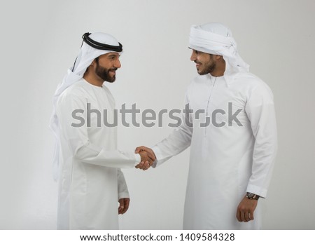 Arab man making hand sign Royalty-Free Stock Photo #1409584328