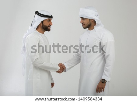 Arab man making hand sign Royalty-Free Stock Photo #1409584334