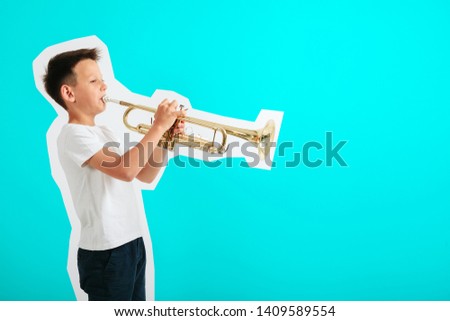 child playing trumpet on turquoise background