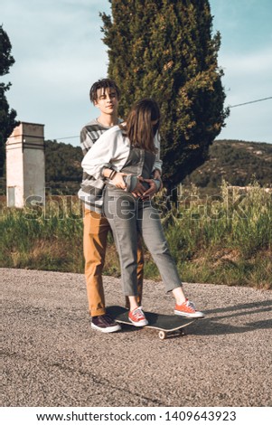 Young people skateboarding and having fun. Skateboard couple