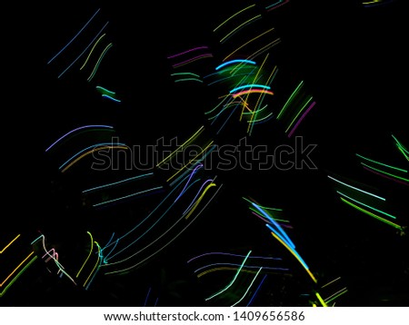 Colorful abstract background with neon lights. Multi colored bright lines, led effect