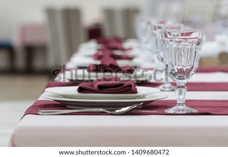 serving banquet table in a luxurious restaurant in pink and white style