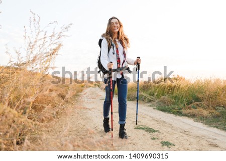 Photo of happy young woman outside in free alternative vacation camping.