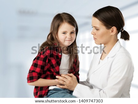 female doctor examining kid little child boy