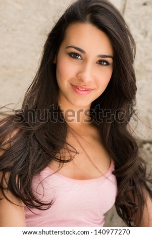 Beautiful young multicultural woman outdoor portrait.