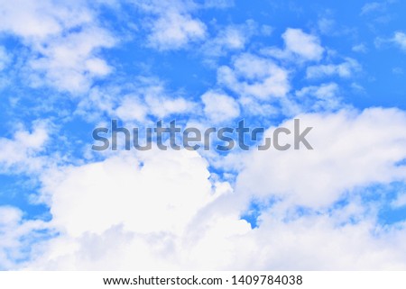 Blue Sky Background with White Fluffy Clouds