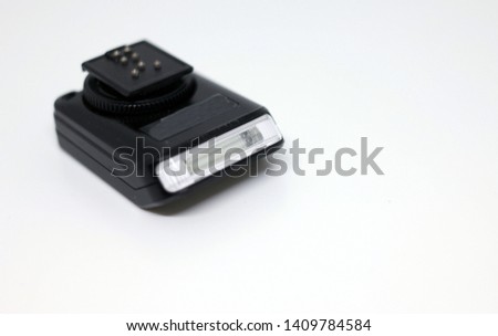 Black camera flash on the table