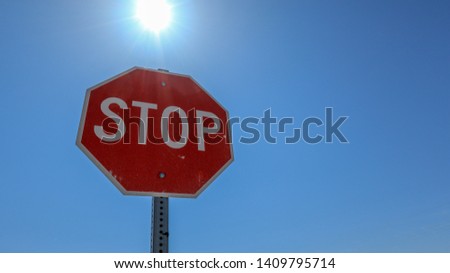 
Stop sign on a blue sky background