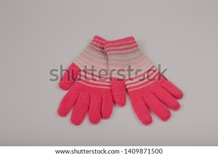 Children's winter gloves on a white background.