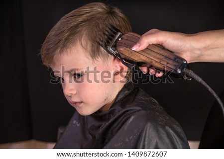 Child haircut with electric razor